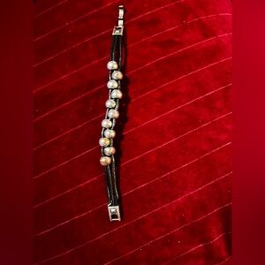 Leather corded and Silvertoned Beaded Bracelet.